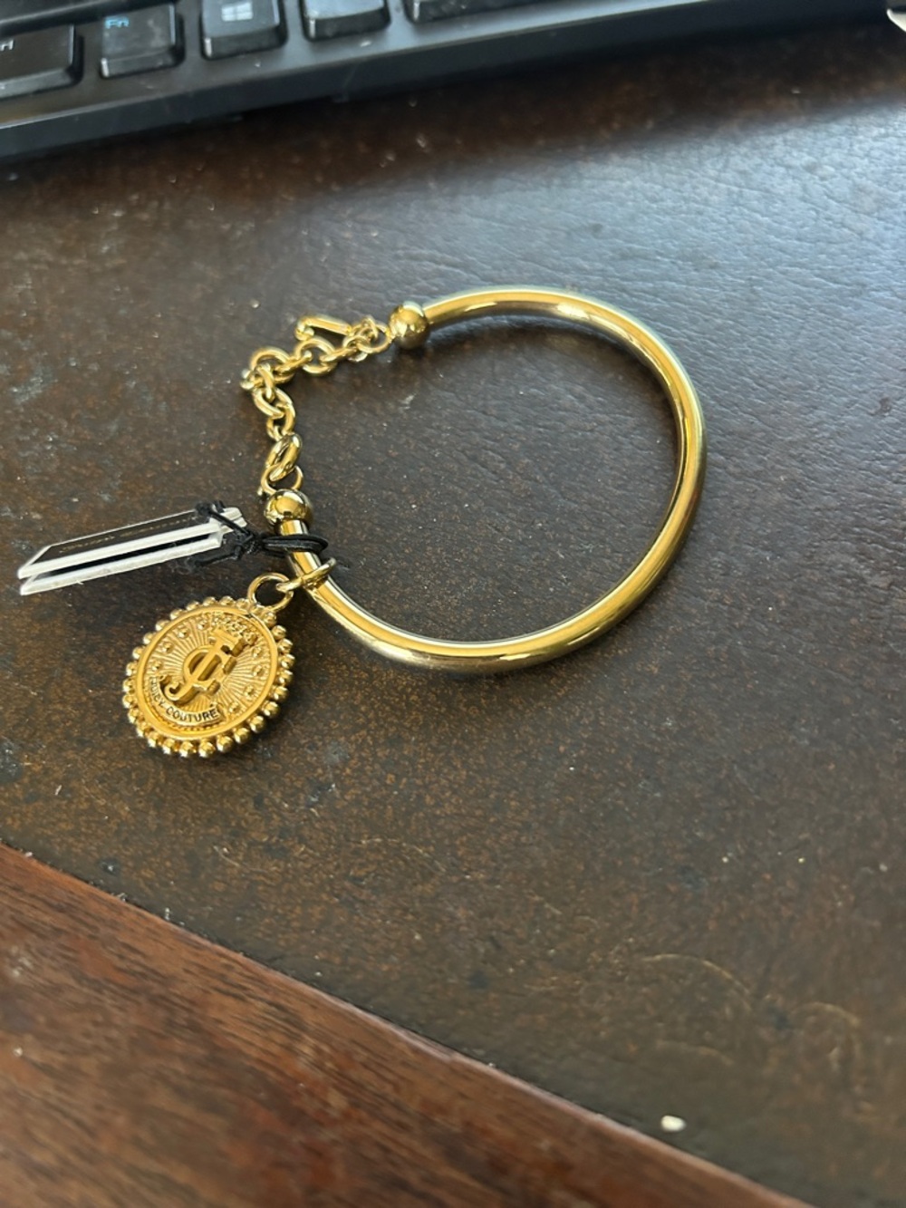 Juicy Couture Gold Tone Charm Bangle with Coin Pendant